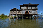 Inle Lake Myanmar. All the buildings are constructed on piles. Residents travel around by canoe, but there are also bamboo walkways and bridges over the canals, monasteries and stupas. 